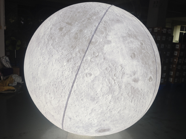 Giant LED inflatable moon ball realistic crater texture glowing white sphere for commercial event mall wedding installation