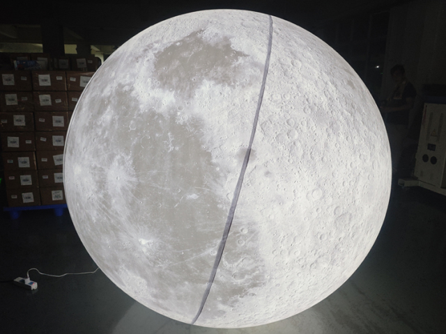 Giant LED inflatable moon ball realistic crater texture glowing white sphere for commercial event mall wedding installation
