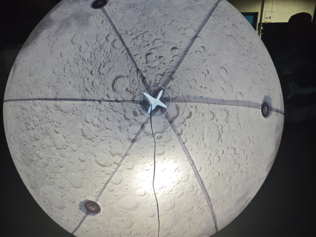 Giant LED inflatable moon ball realistic crater texture glowing white sphere for commercial event mall wedding installation