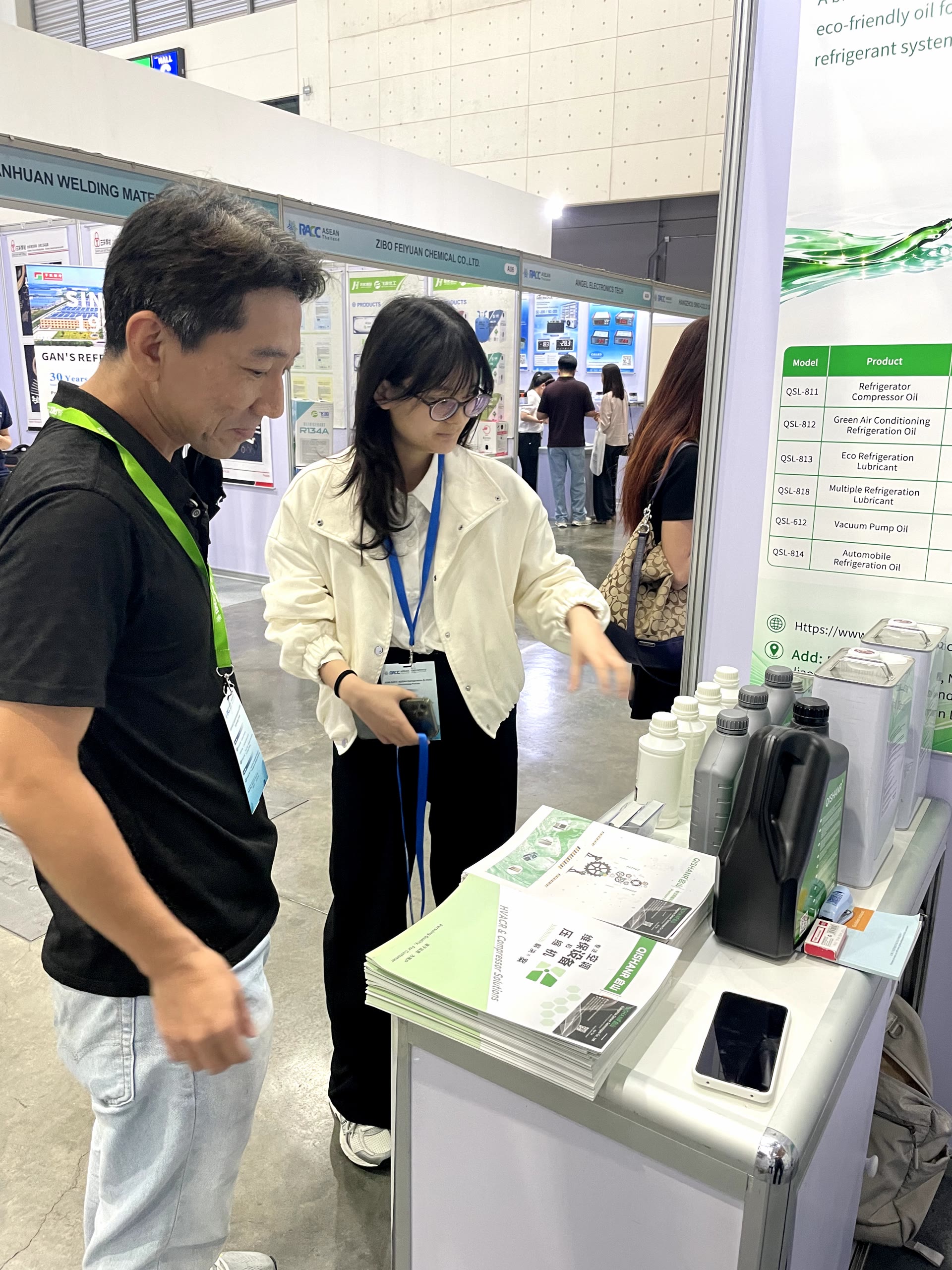 Qishanr representative discussing QSL refrigeration oil products
