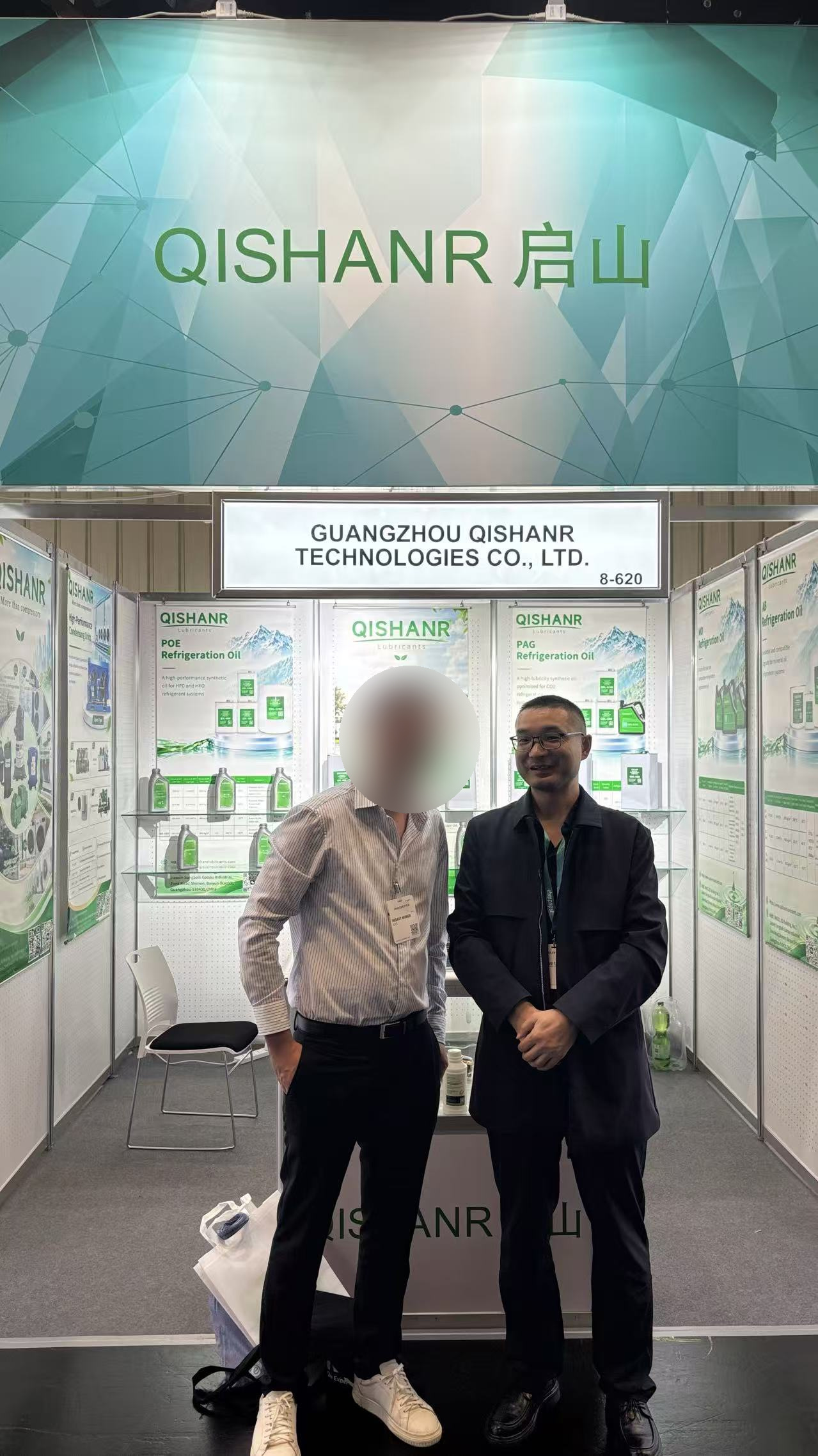 Qishanr team with a visitor at Booth 8-620