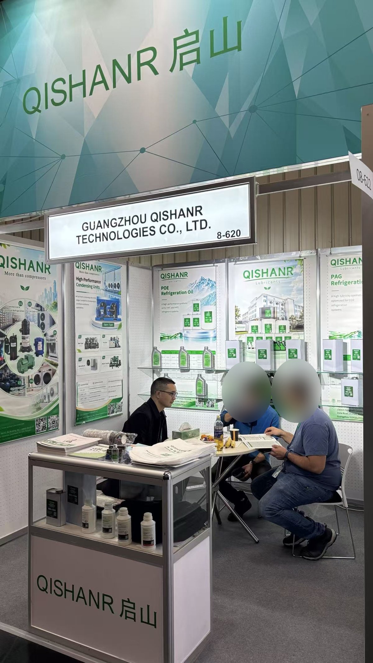 Discussion at the Qishanr booth table