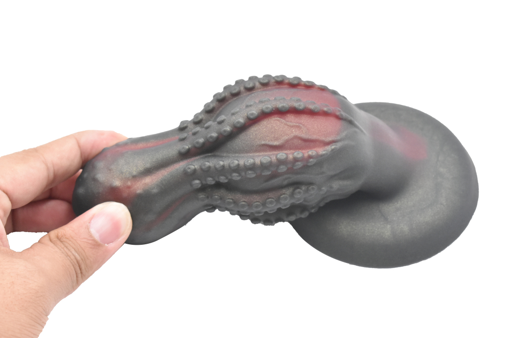 The false penis in the shape of an octopus skull anus plug is made of silicone and has suction cups