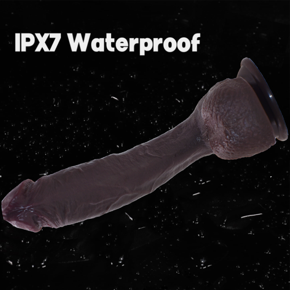 The non-functional adult humanized silicone prosthetic penis is brownish-black