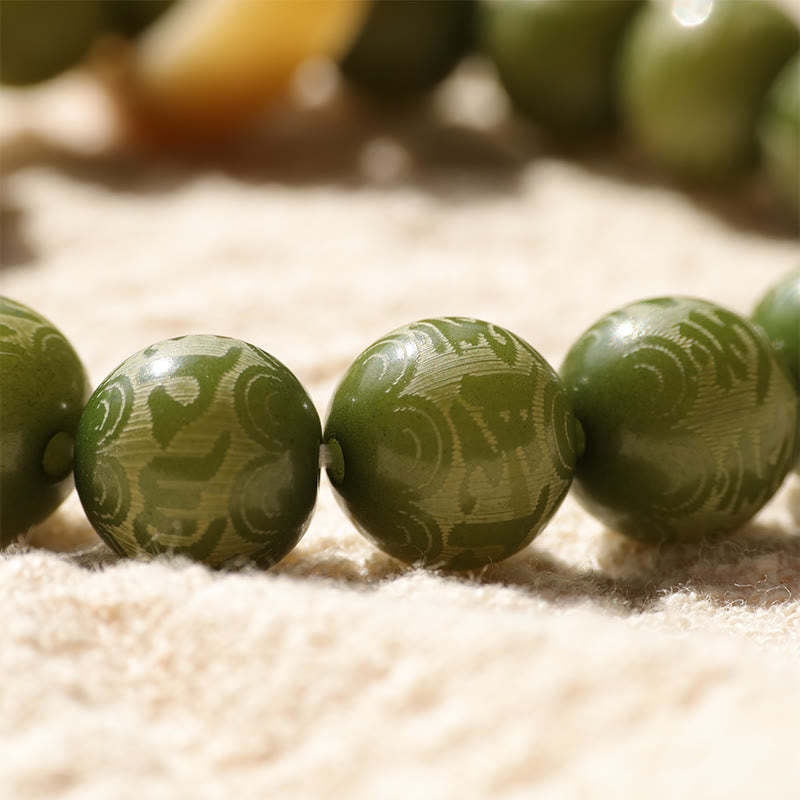Green Bodhi Seed Ivory Fruit Dancing Lion Om Mani Padme Hum Engraved Peace Bracelet