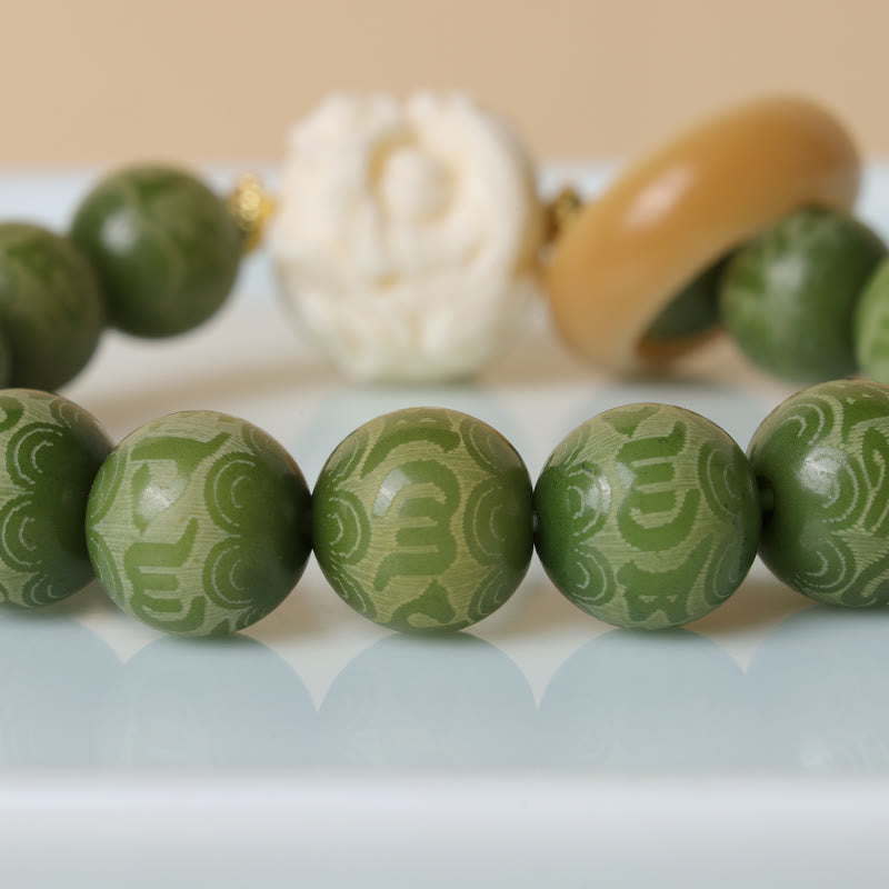 Green Bodhi Seed Ivory Fruit Dancing Lion Om Mani Padme Hum Engraved Peace Bracelet