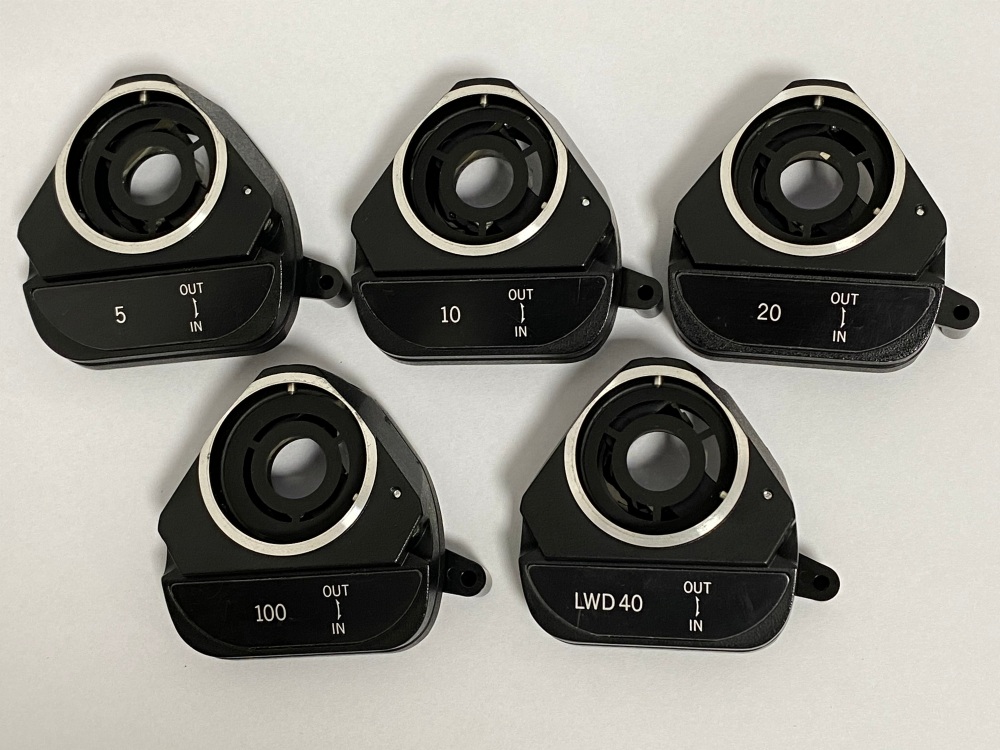Bottom view of Olympus DIC prisms sliders showing optics