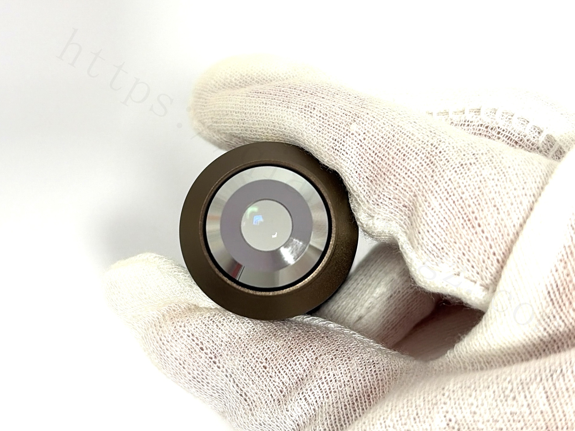 Close-up of the front optical lens element of Nikon Plan 10X objective