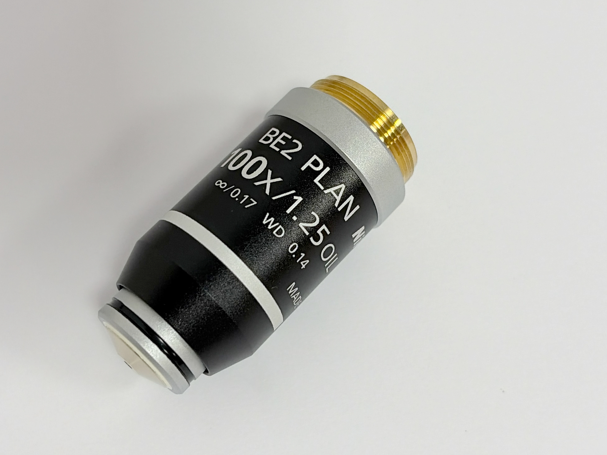 Nikon BE2 Plan 100X 1.25 Oil Microscope Objective Lens front view