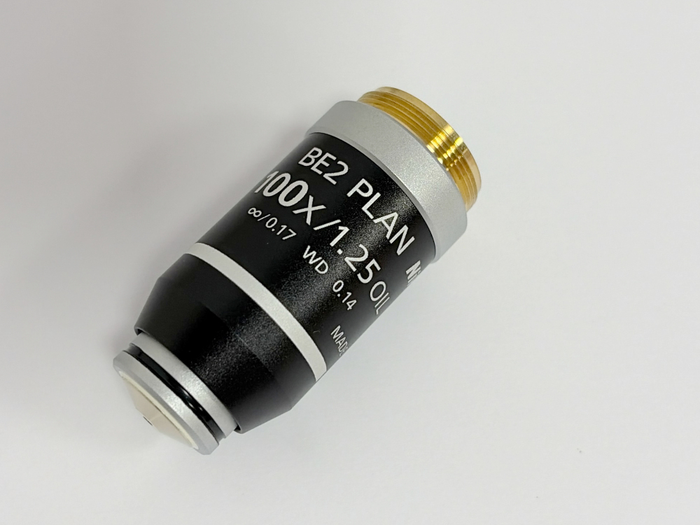 Nikon BE2 Plan 100X 1.25 Oil Microscope Objective Lens front view