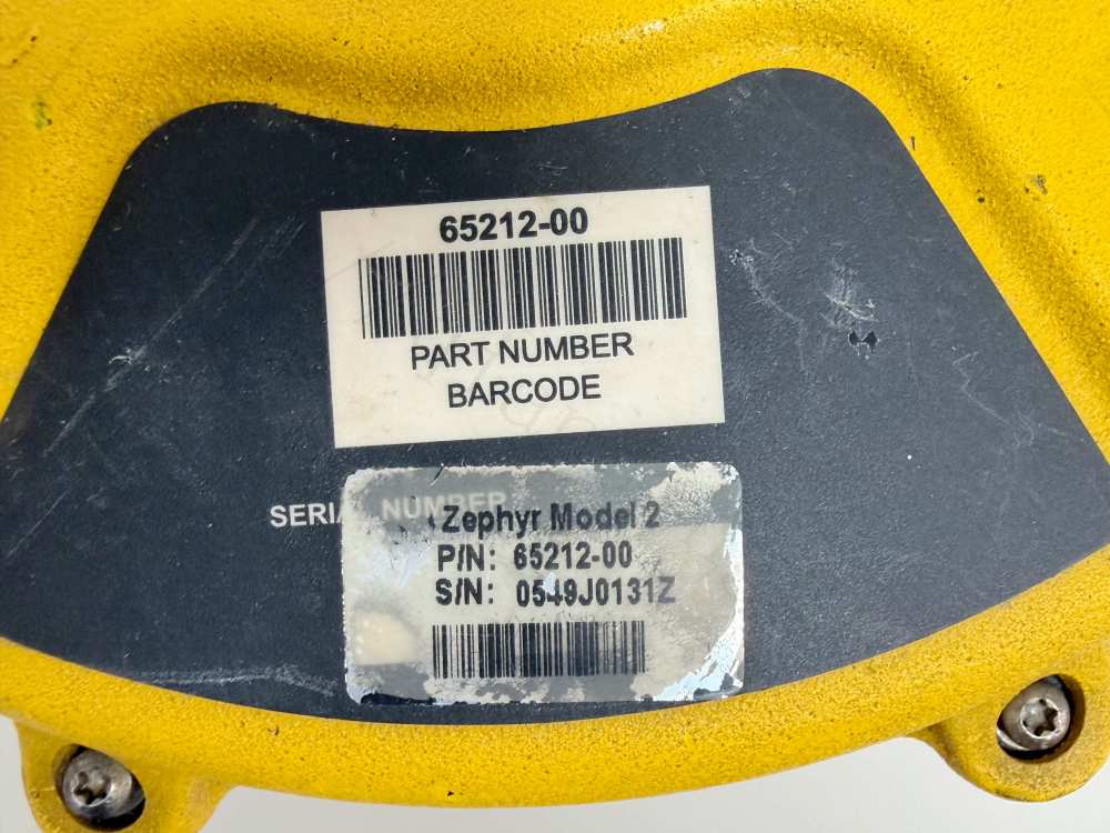 Alt: Close-up showing Trimble part number 65212-00 and serial number barcode