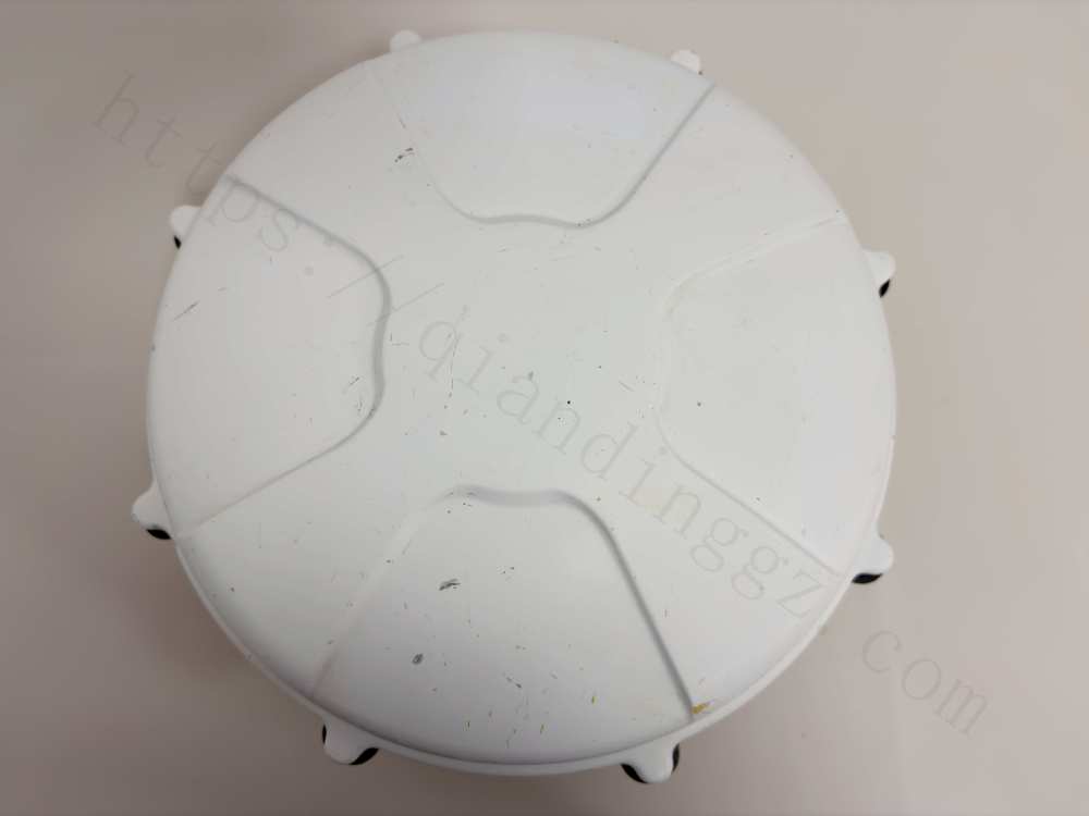 Alt: Direct top-down view of Trimble Zephyr 2 antenna white radome