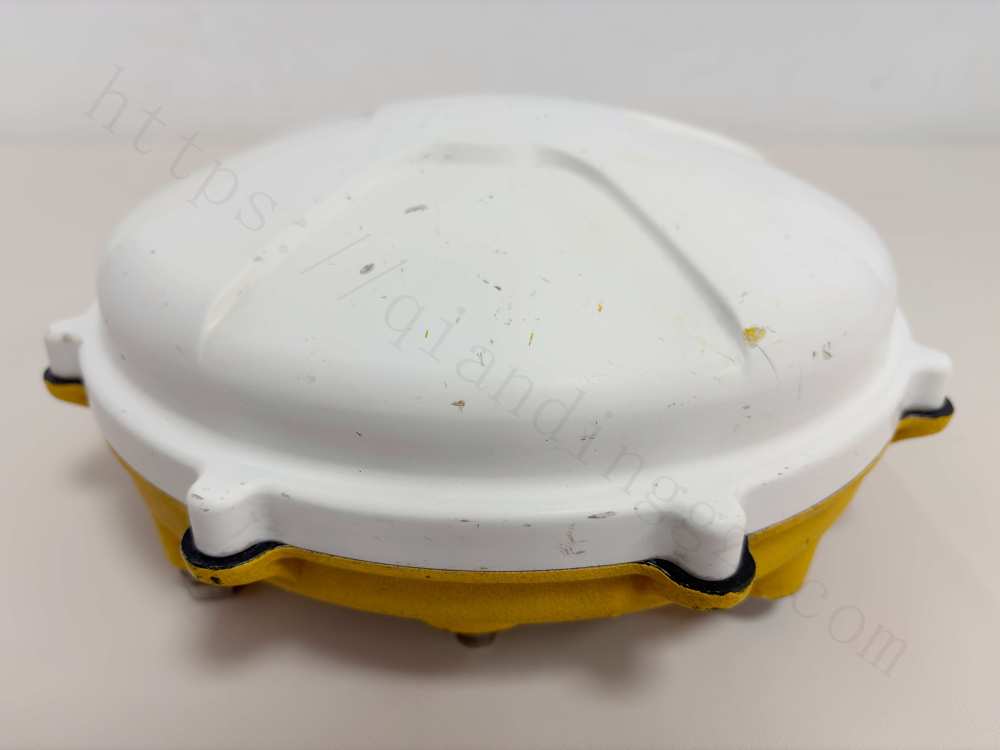 Alt: Low angle view of Trimble Zephyr Model 2 antenna showing rugged base