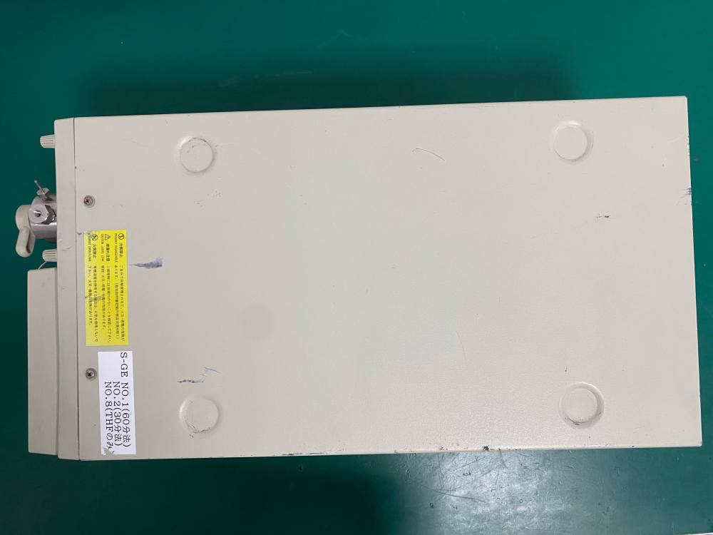 Top view of the outer casing of a pre-owned Tosoh DP-8020 lab pump with safety warning stickers