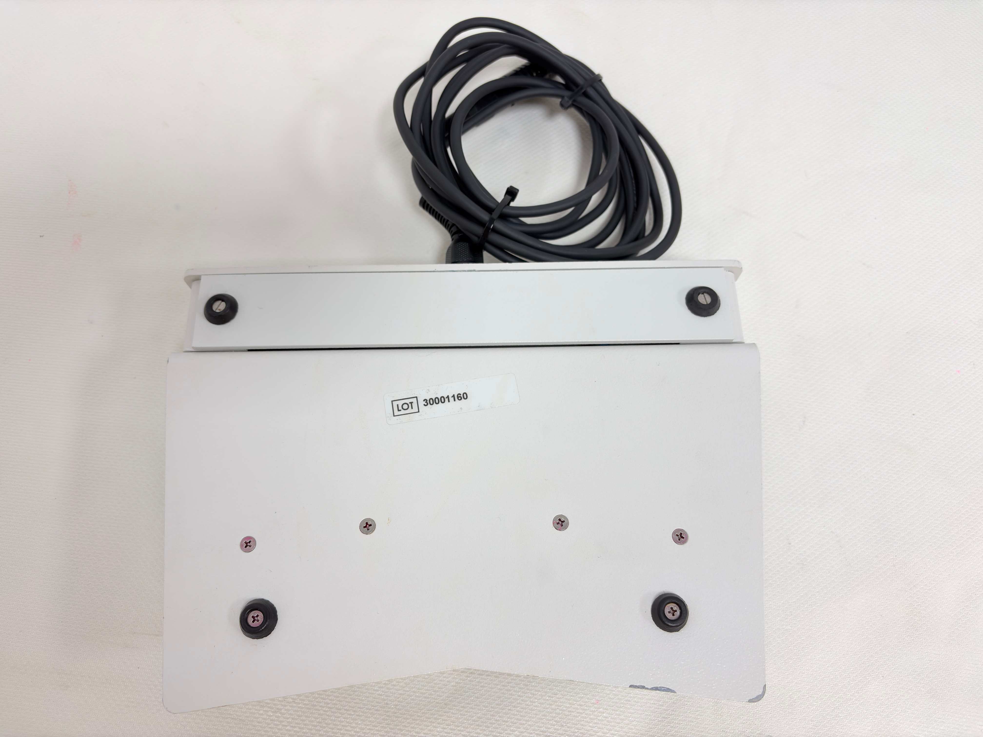 Bottom base and lot label of Olympus SPL-FS surgical footswitch
