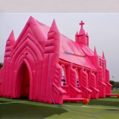 Giant pink inflatable church with cross and spires for wedding