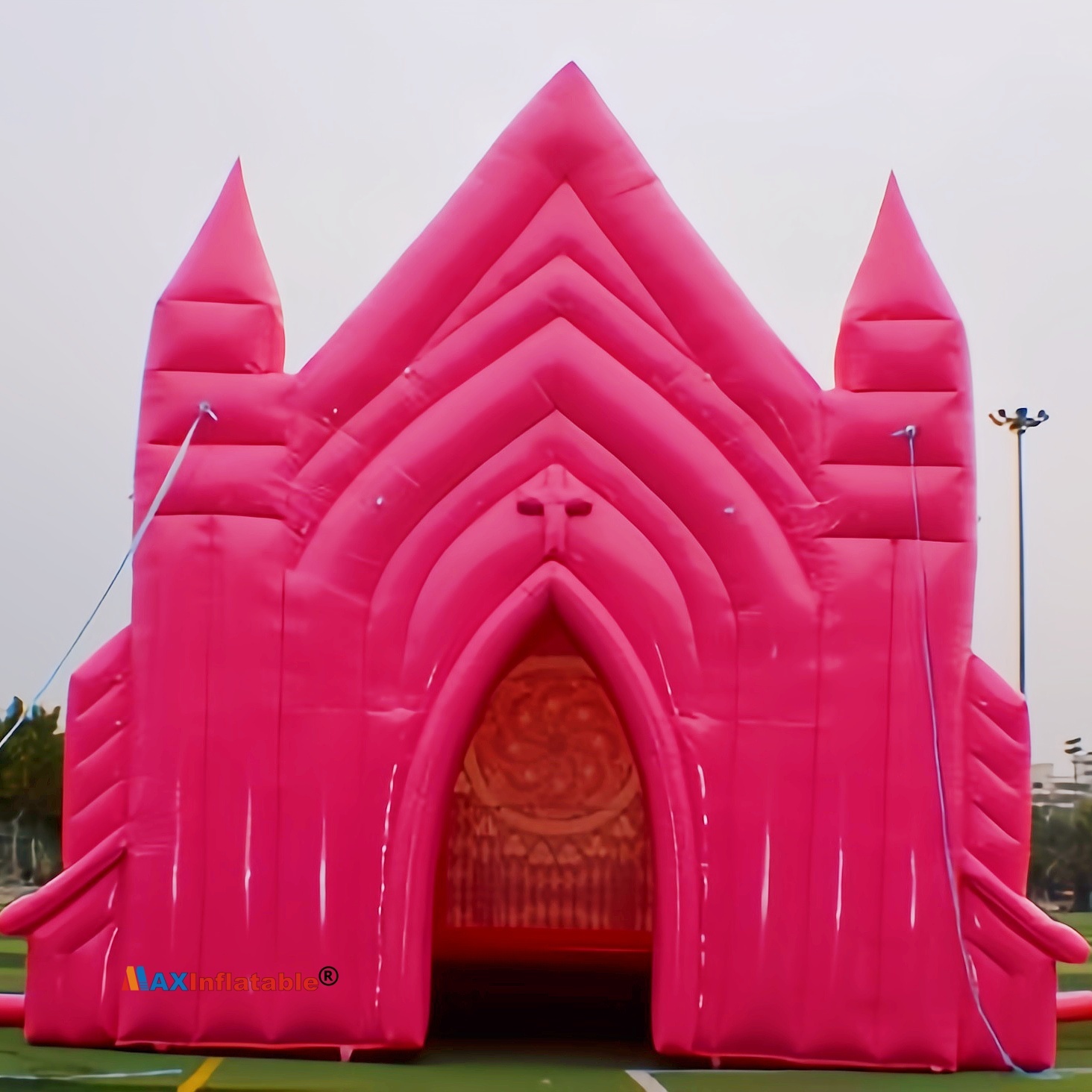 Custom pink inflatable chapel venue with arched entrance