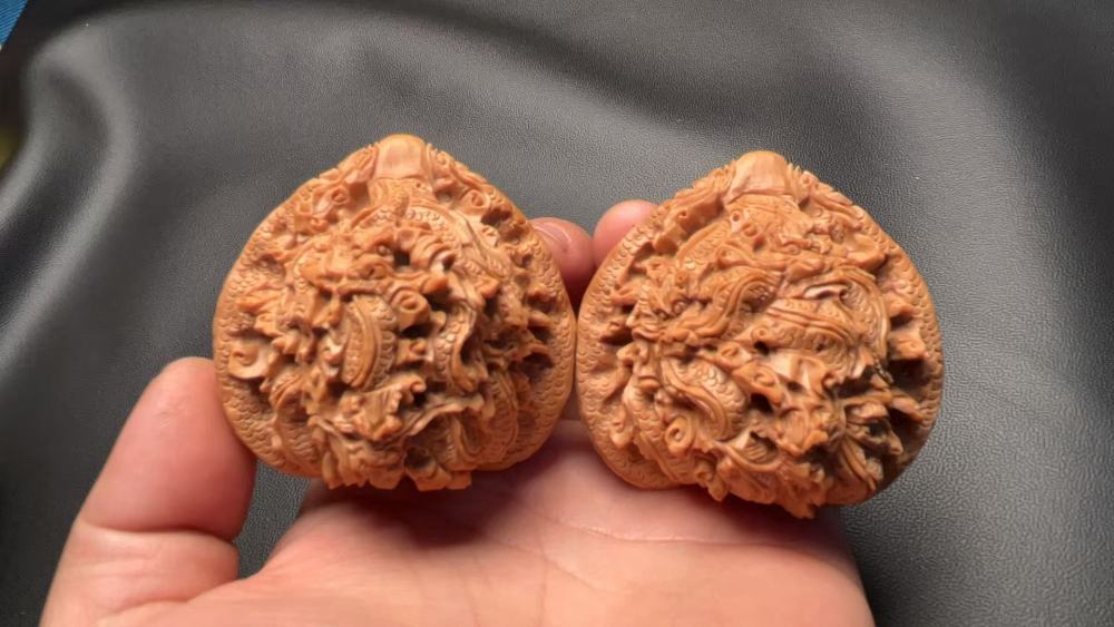 Hand-carved walnuts with nine dragons playing with a pearl, purely handmade, exquisite pair, from old tree fruit, a perfect gift, believed to help prevent Alzheimer's disease and promote health and wellness.