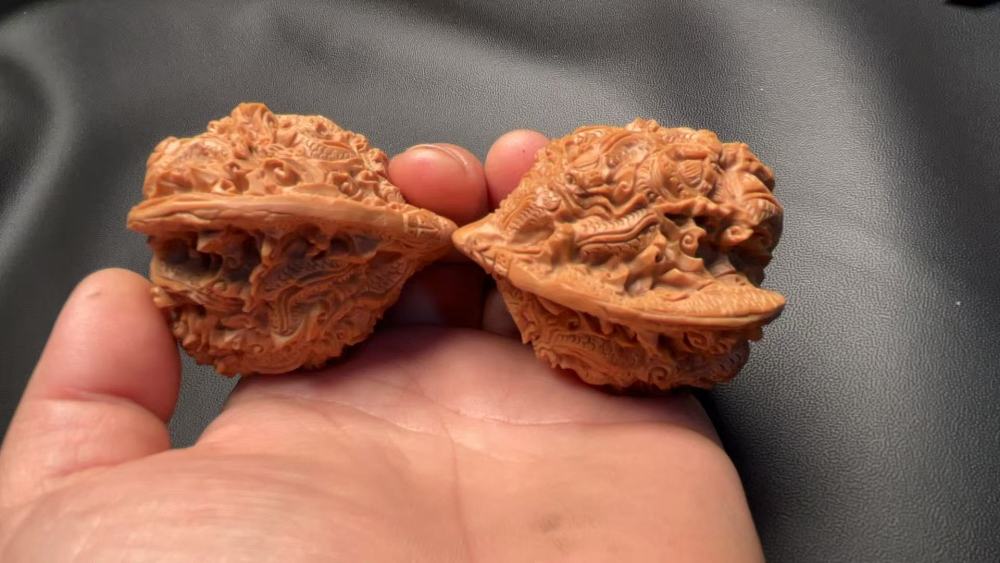 Hand-carved walnuts with nine dragons playing with a pearl, purely handmade, exquisite pair, from old tree fruit, a perfect gift, believed to help prevent Alzheimer's disease and promote health and wellness.