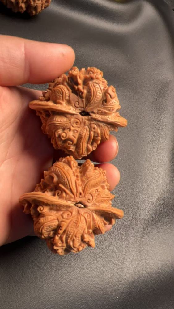 Hand-carved walnuts with nine dragons playing with a pearl, purely handmade, exquisite pair, from old tree fruit, a perfect gift, believed to help prevent Alzheimer's disease and promote health and wellness.