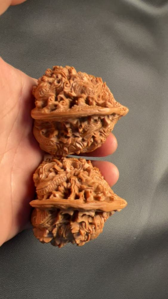 Hand-carved walnuts with nine dragons playing with a pearl, purely handmade, exquisite pair, from old tree fruit, a perfect gift, believed to help prevent Alzheimer's disease and promote health and wellness.