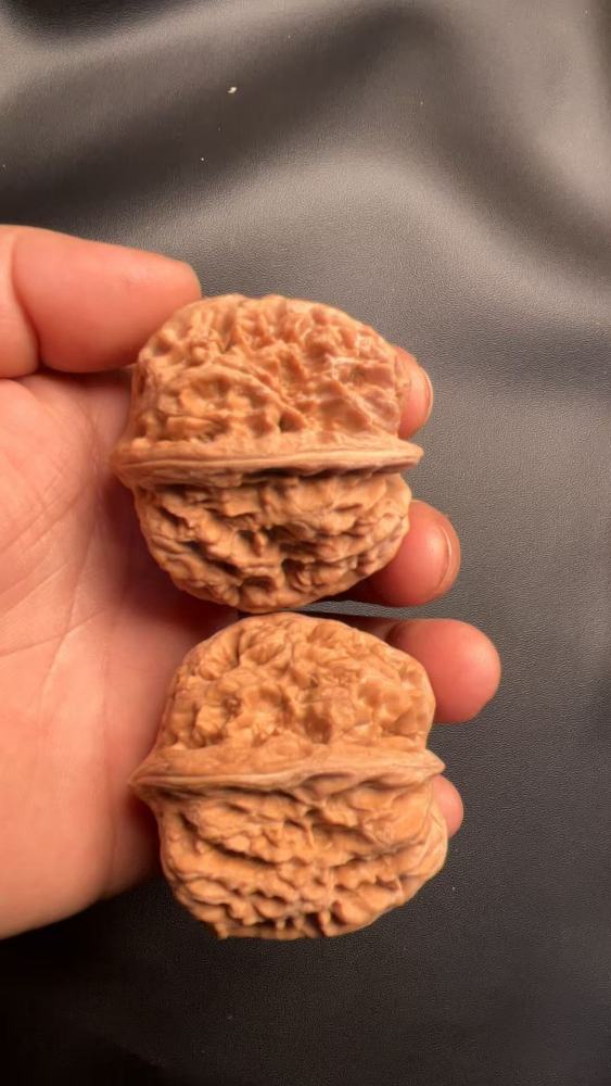 Handcrafted walnuts, a type of walnut known for its robust shape and natural growth. These are flawless, unprocessed walnuts from old, naturally formed trees with a high-quality, dense texture.