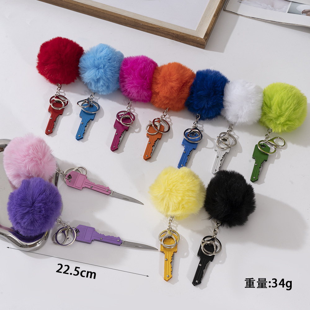 Wholesale key knife + fur ball key chain.