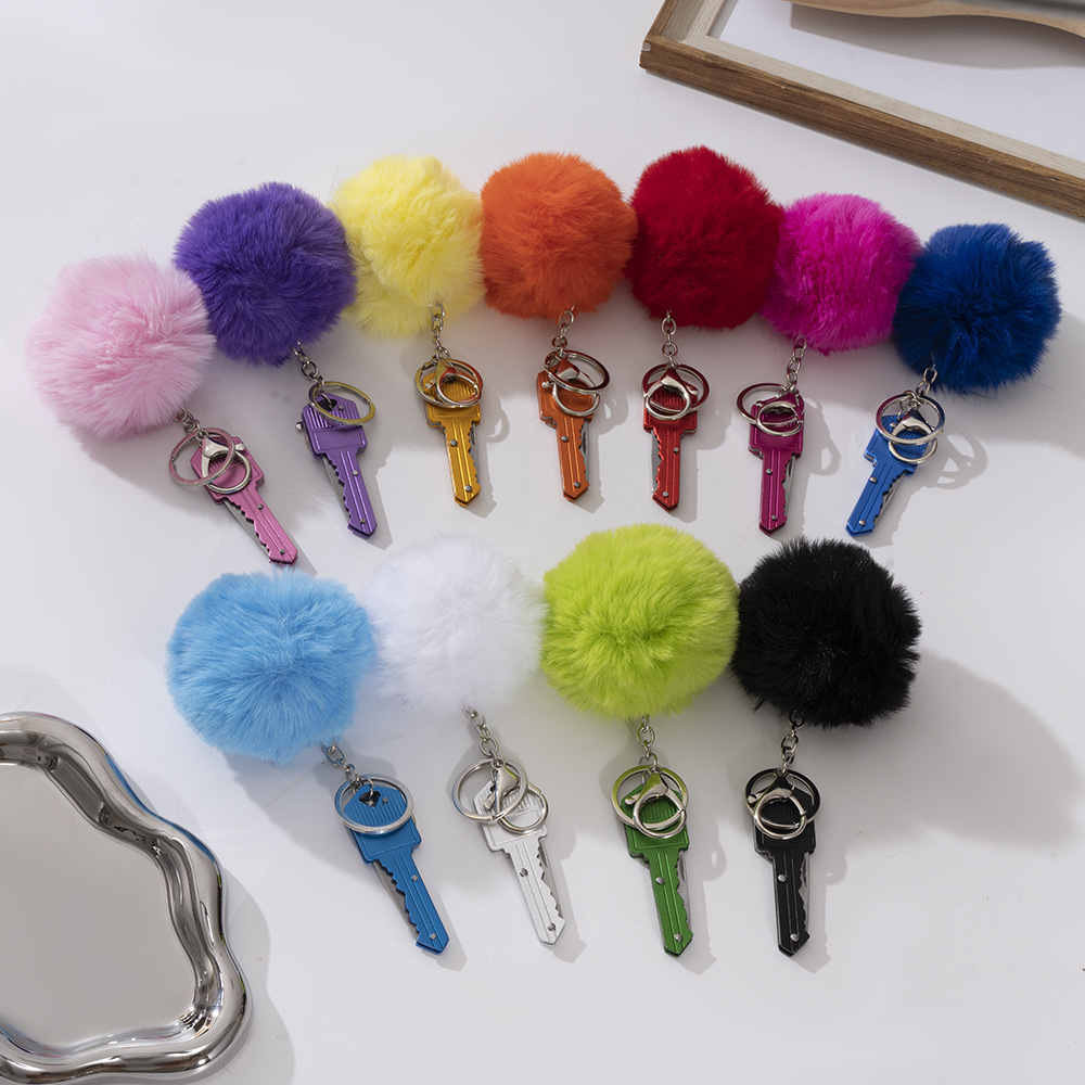 Wholesale key knife + fur ball key chain.