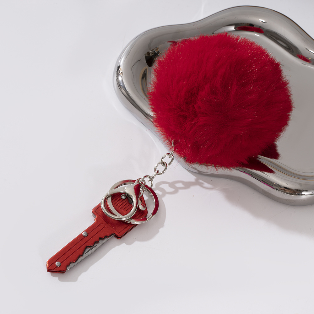 Wholesale key knife + fur ball key chain.