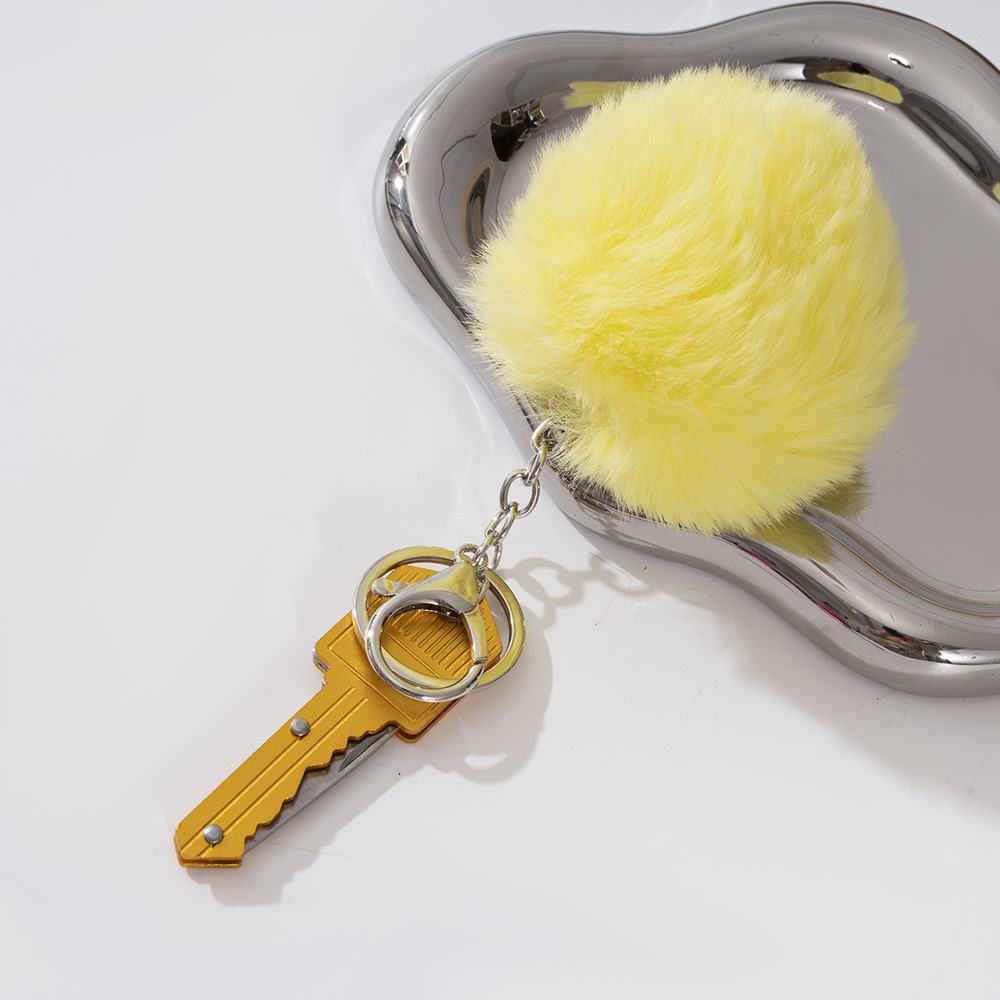 Wholesale key knife + fur ball key chain.