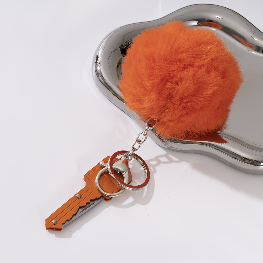 Wholesale key knife + fur ball key chain.