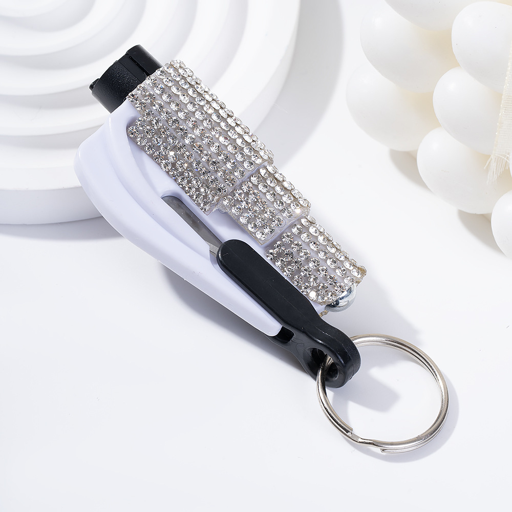 Wholesale bling seat belt cutter / window breaker keychain.