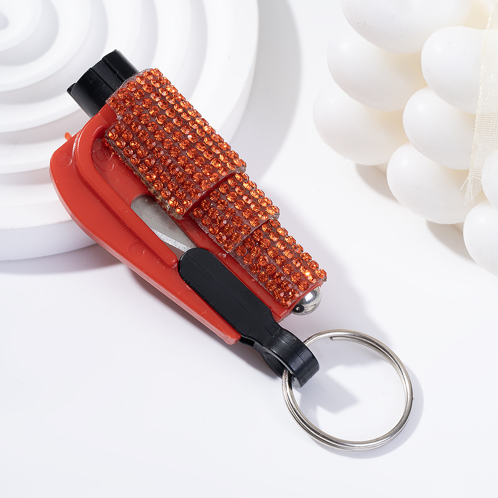 Wholesale bling seat belt cutter / window breaker keychain.