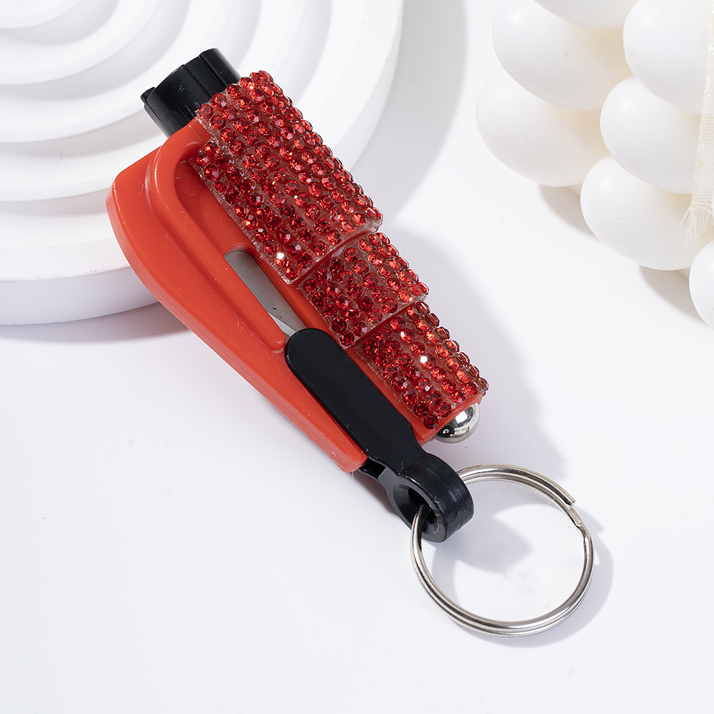 Wholesale bling seat belt cutter / window breaker keychain.