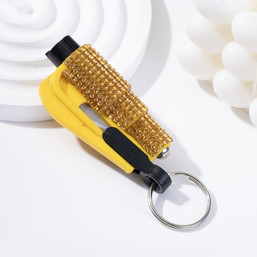 Wholesale bling seat belt cutter / window breaker keychain.