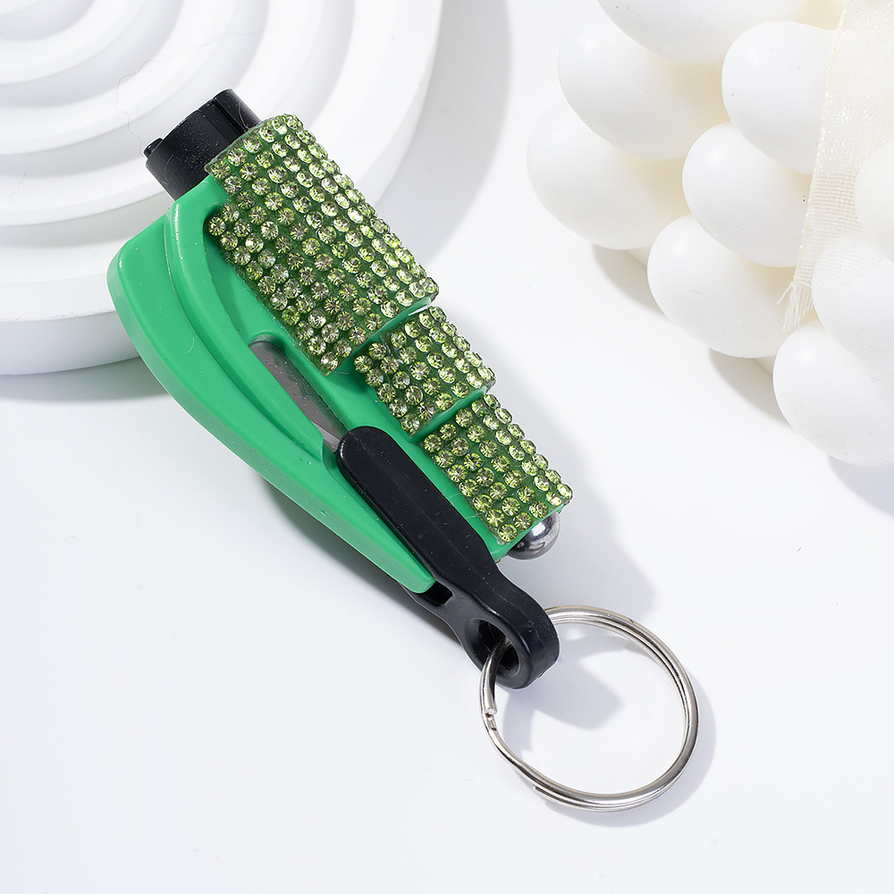 Wholesale bling seat belt cutter / window breaker keychain.
