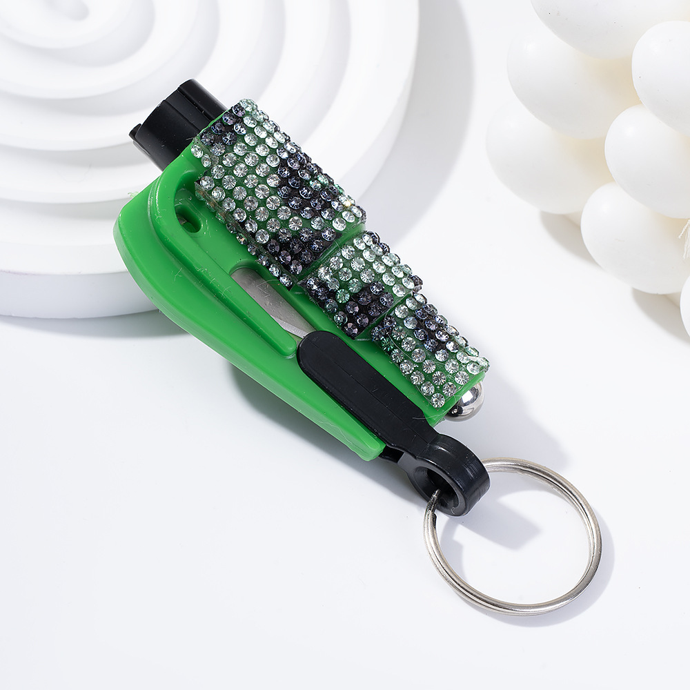 Wholesale bling seat belt cutter / window breaker keychain.