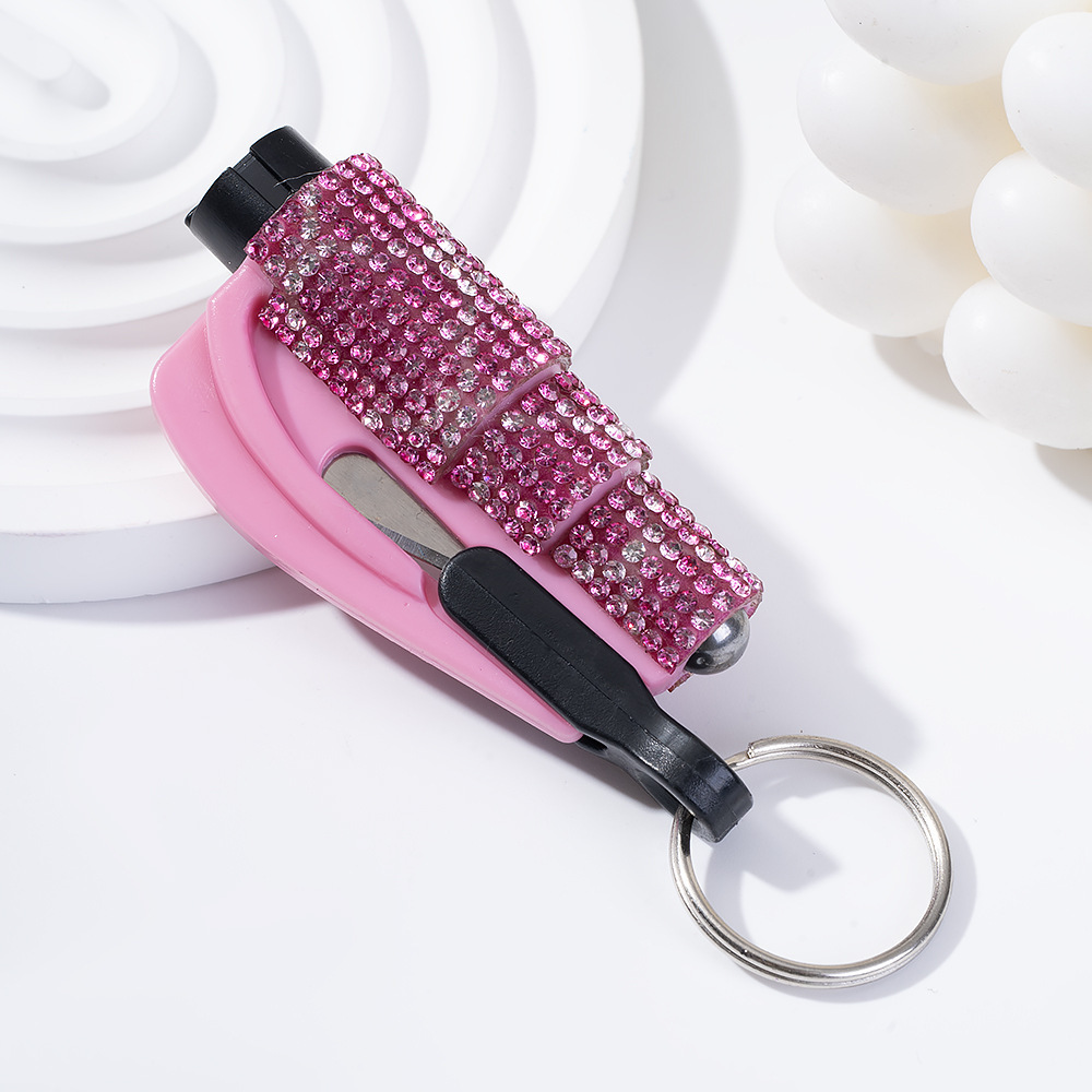 Wholesale bling seat belt cutter / window breaker keychain.