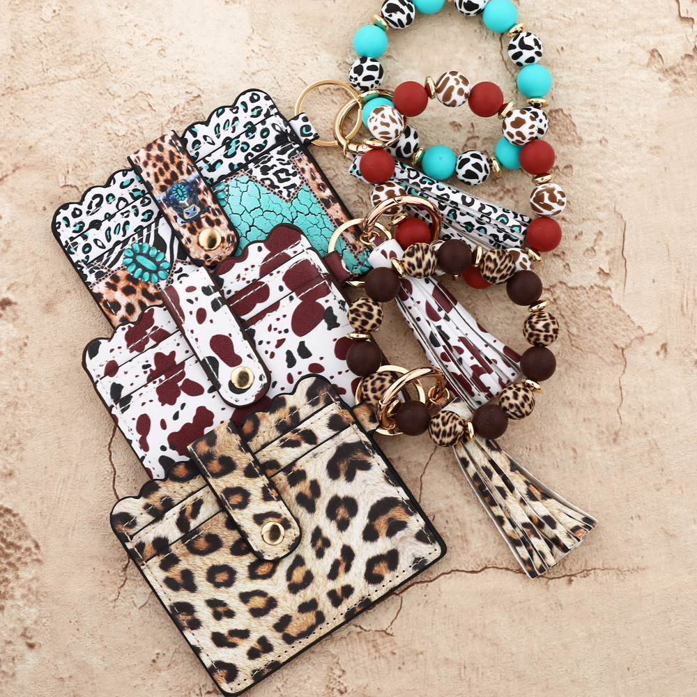 Wholesale colorful cow pattern card holder silicone wristband keychain.