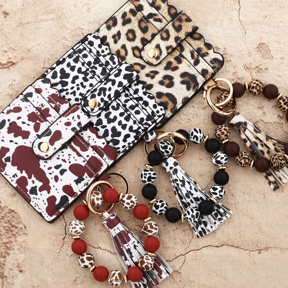 Wholesale colorful cow pattern card holder silicone wristband keychain.