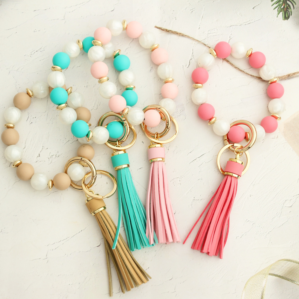European and American cross-border new products 2024 silicone bead bracelet ladies wrist keychain tassel pendant anti-lost wooden bead bracelet
