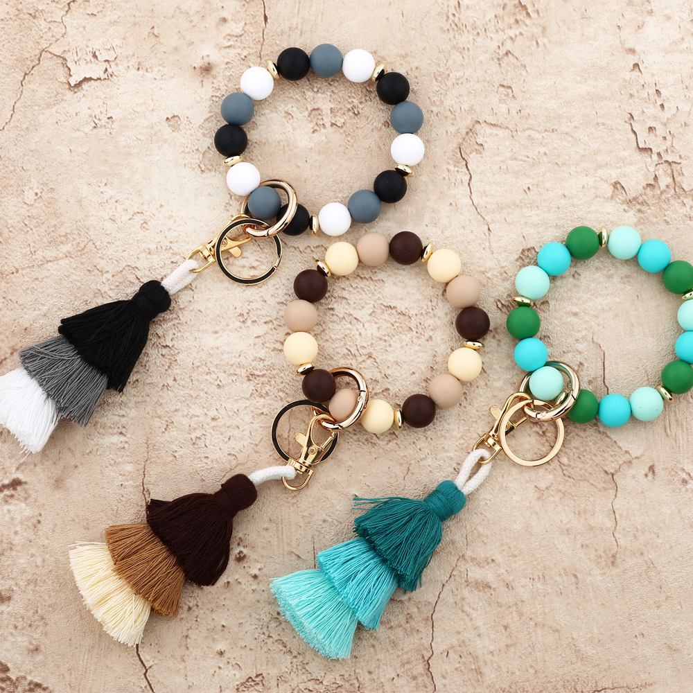 Cross-border jewelry 2024 Japanese and Korean fashion women's INS bracelet colorful three-layer line tassel silicone bracelet keychain