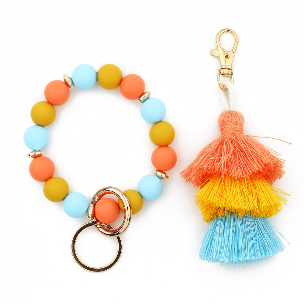 Cross-border jewelry 2024 Japanese and Korean fashion women's INS bracelet colorful three-layer line tassel silicone bracelet keychain