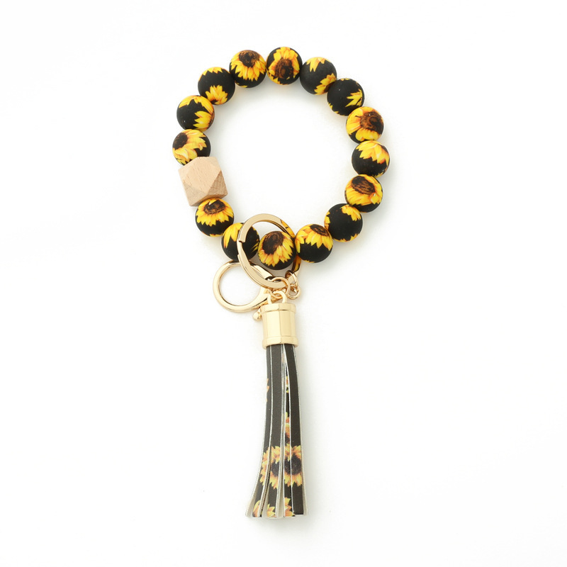 Wholesale color printed pattern silicone wristband keychain.