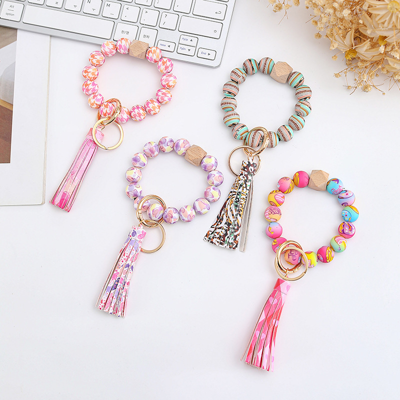 Wholesale colorful silicone printed beads keychains.