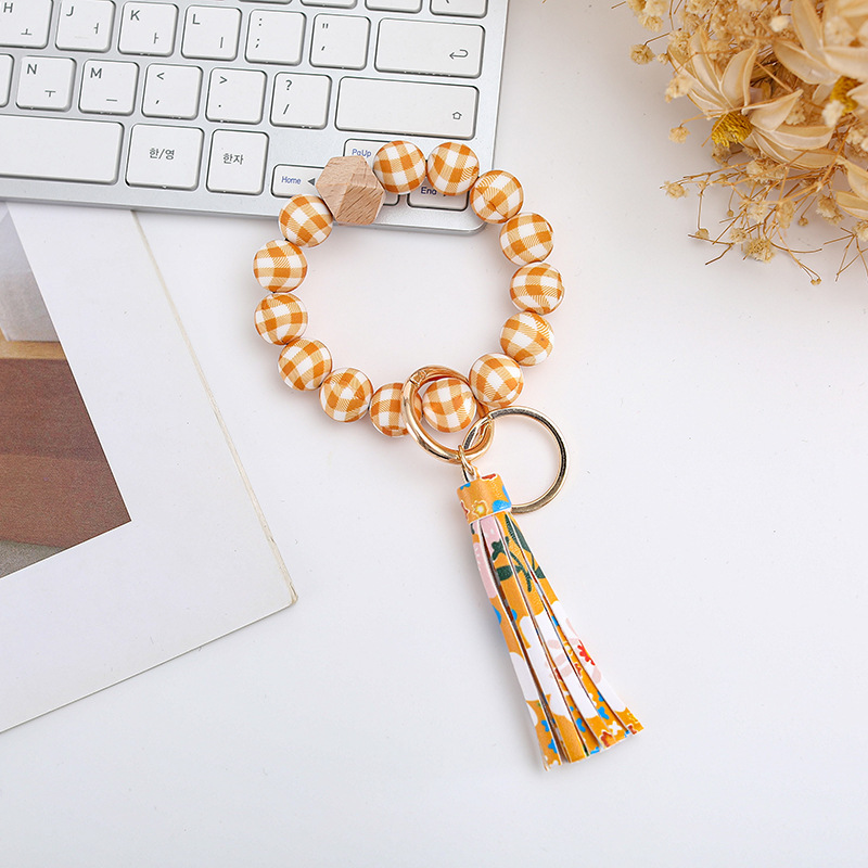 Wholesale colorful silicone printed beads keychains.