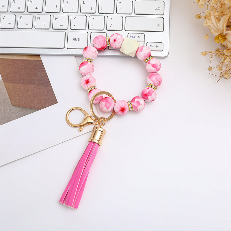 Wholesale colorful silicone printed beads keychains.