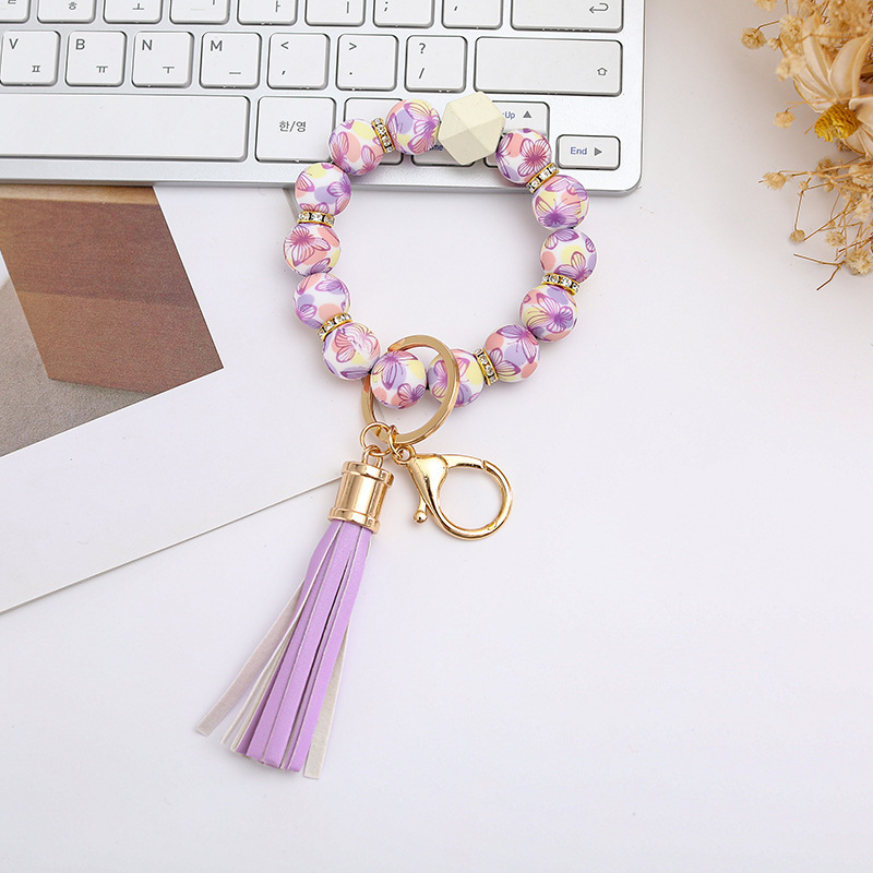 Wholesale colorful silicone printed beads keychains.