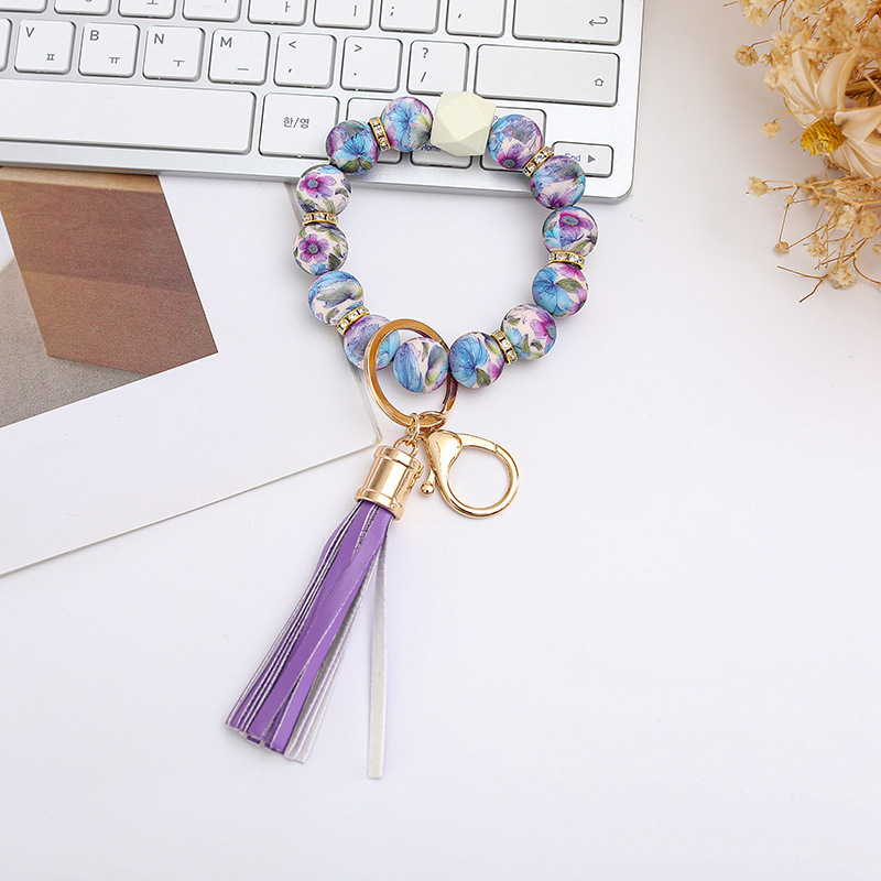 Wholesale colorful silicone printed beads keychains.