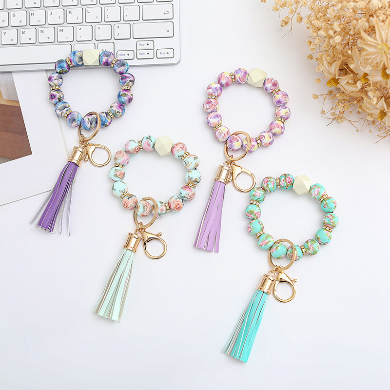 Wholesale colorful silicone printed beads keychains.